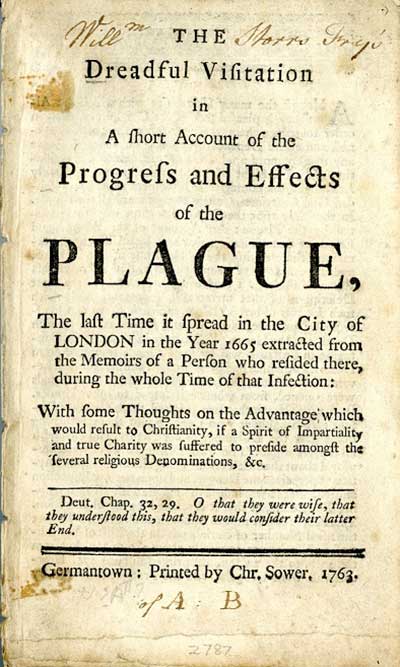 man reading book in library