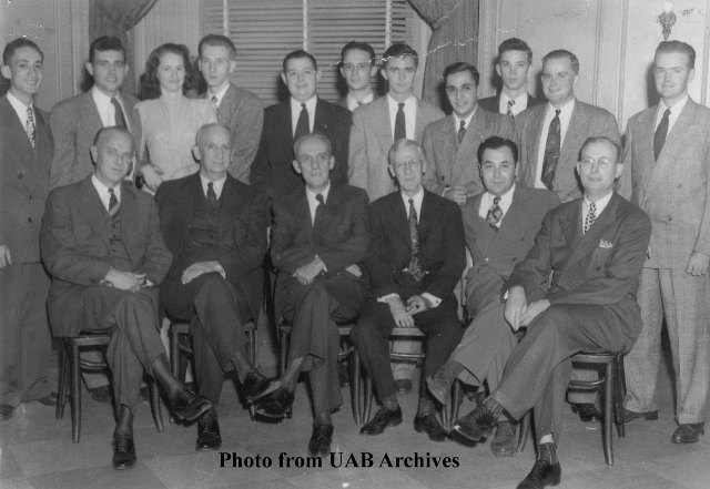 A group of people pose for a picture