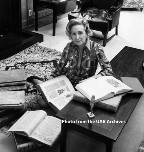 Sarah Cole Brown displays several items from Reynolds Historical Library