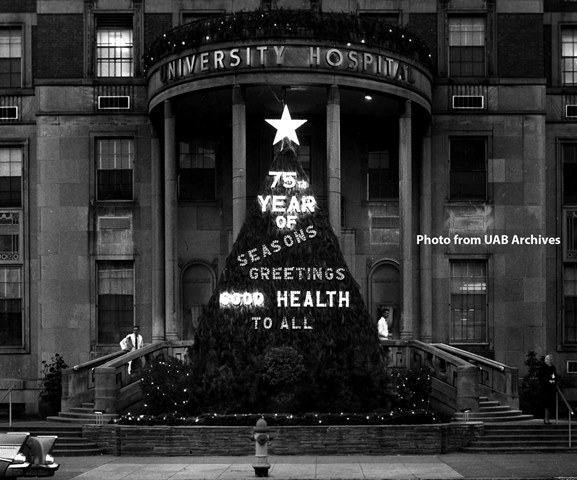 Outside of University Hospital with a lit up Christmas tree sign