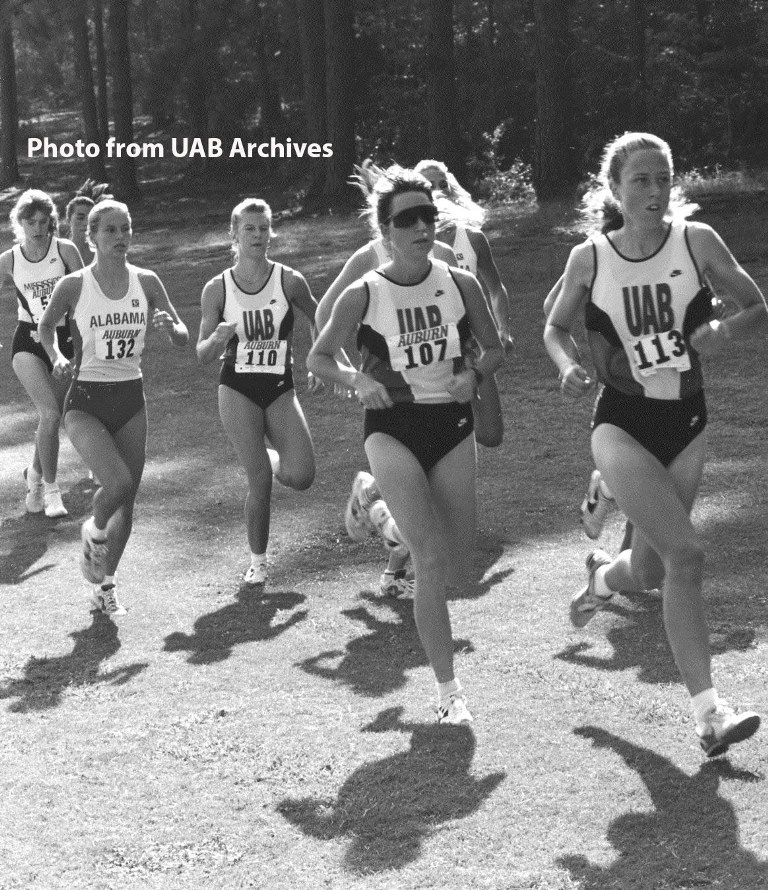 Female runners going through a wooded area