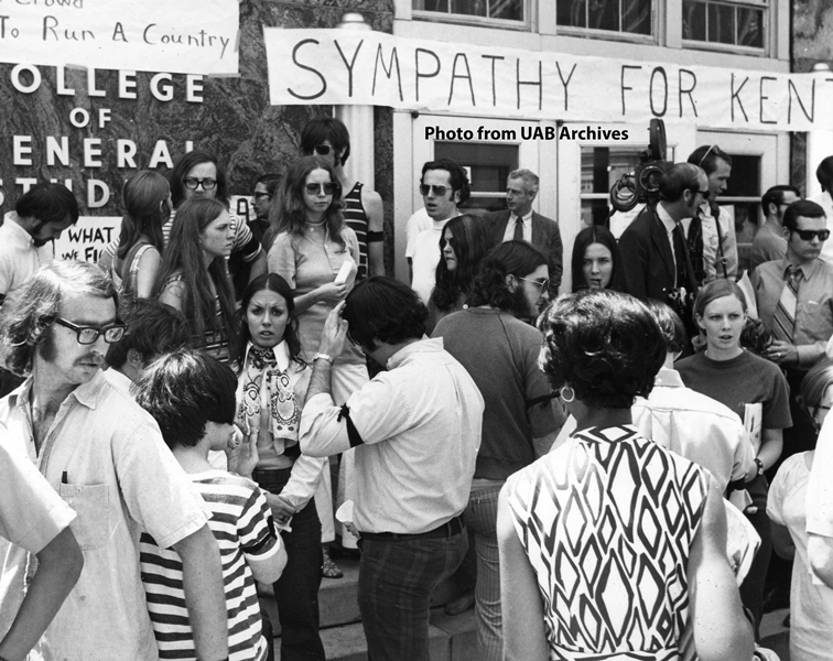 Protestors gather in front of the College of General Studies building