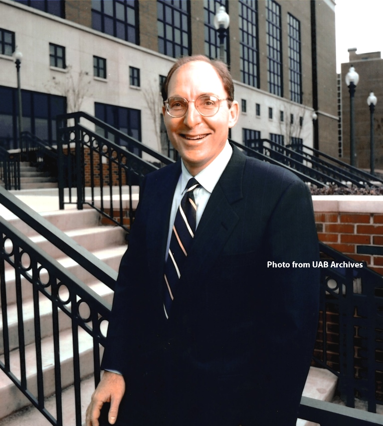 Dean Capilouto poses on a set of steps